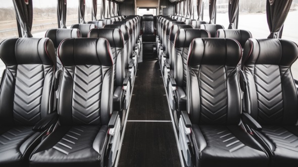 56 passenger charter bus inside the colony